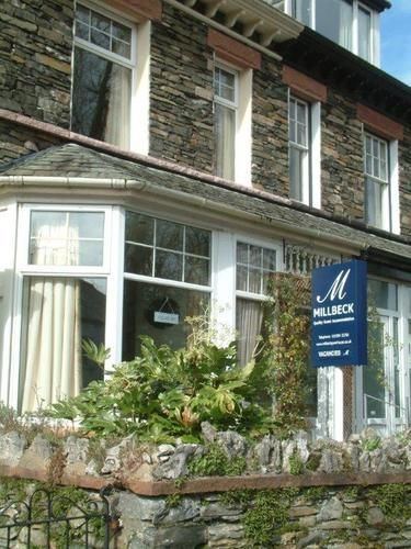 Millbeck Guest House frontage with stone wall and gate