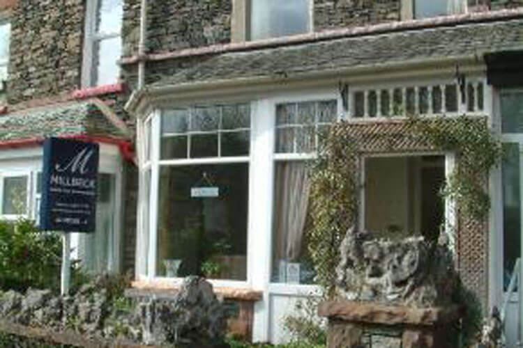 Millbeck sign outside the stone cottage